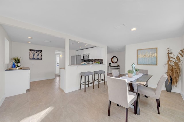 4059 Orient Dr, Hernando Beach, FL 34607 - dining area featuring baseboards, recessed lighting, and light tile patterned flooring
