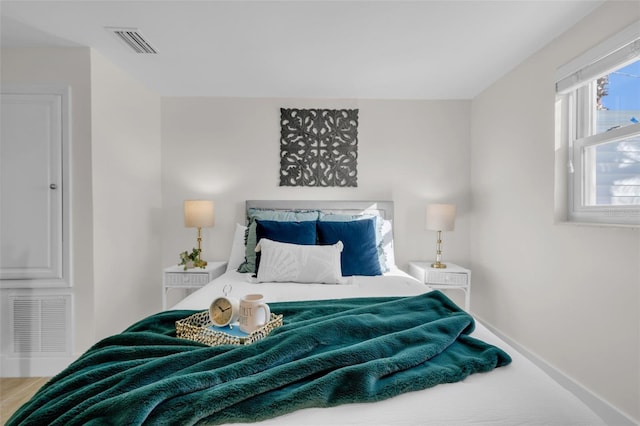 bedroom featuring hardwood / wood-style flooring