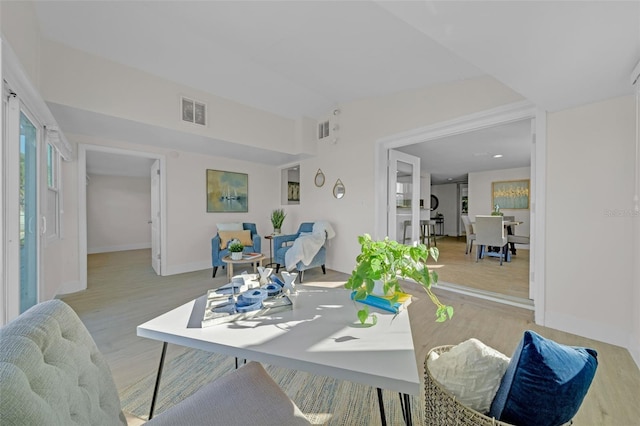 living room with light hardwood / wood-style flooring