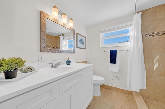 bathroom featuring tile patterned flooring, vanity, curtained shower, and toilet