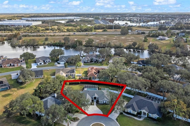 birds eye view of property with a water view