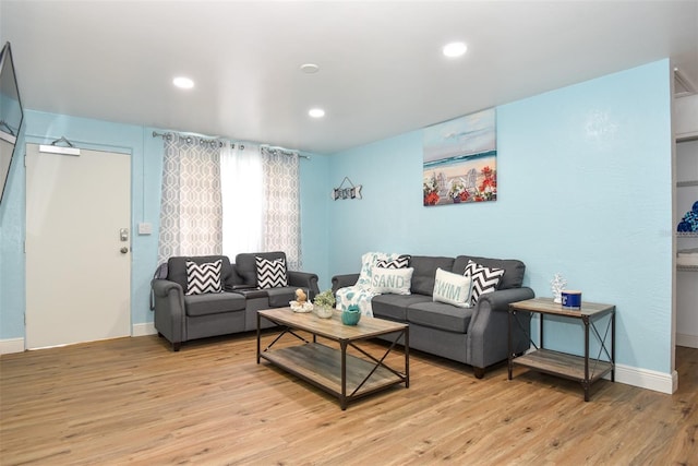 living room with light hardwood / wood-style floors