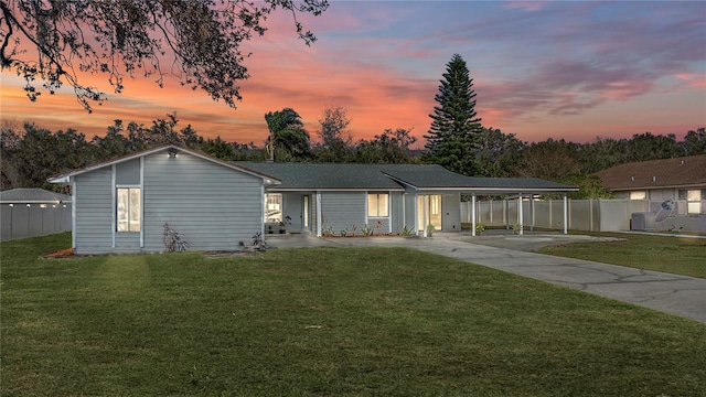 3743 Red Oak Ct, Lake Wales, FL 33898 - ranch-style house featuring a carport, cooling unit, and a yard
