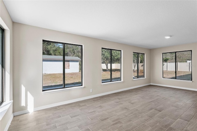 spare room with light hardwood / wood-style floors