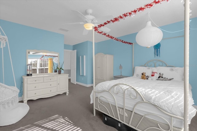 bedroom featuring dark colored carpet and ceiling fan