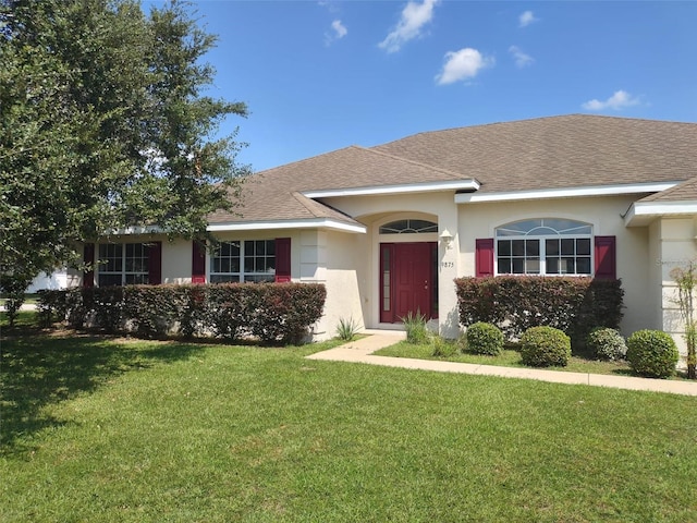 ranch-style house featuring a front lawn