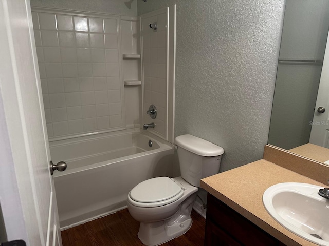 full bathroom featuring vanity, wood-type flooring,  shower combination, and toilet