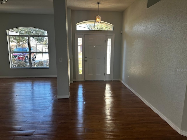 entrance foyer featuring dark wood-type flooring