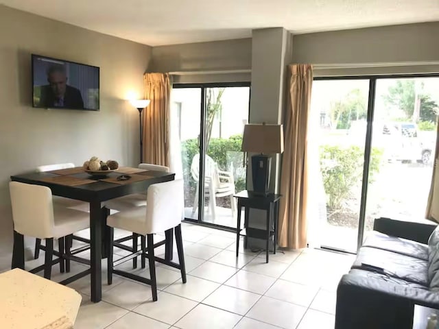 dining space featuring light tile patterned floors