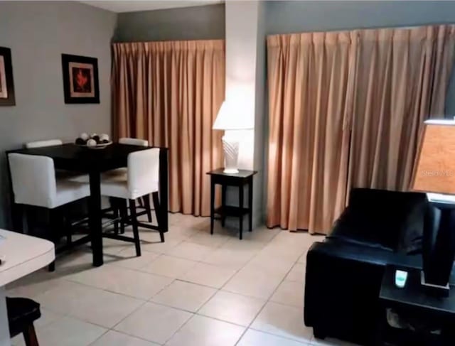 sitting room with light tile patterned floors