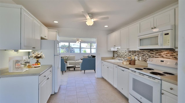 kitchen with white cabinetry, ceiling fan, white appliances, decorative backsplash, and light tile patterned flooring