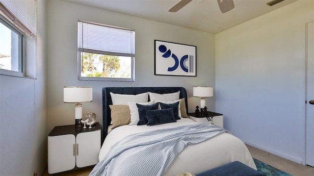 bedroom with ceiling fan and carpet floors