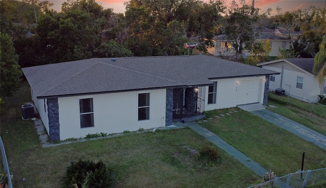 1048 Wakefield Cir, Deltona, FL 32725 - single story home with stucco siding, driveway, a garage, and roof with shingles