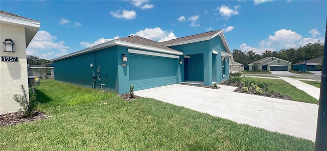 view of front facade featuring a garage and a front lawn