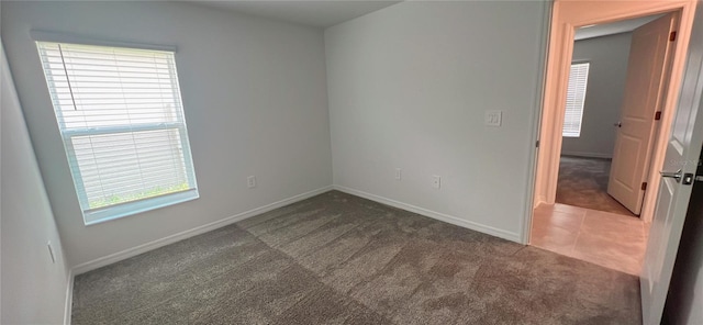 empty room featuring dark carpet