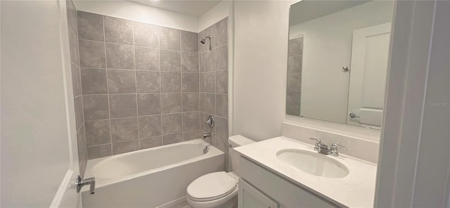 full bathroom featuring vanity, tiled shower / bath combo, and toilet