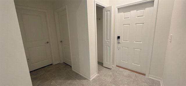 hallway with light tile patterned floors