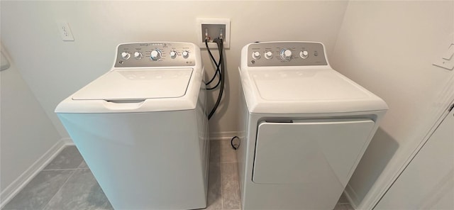 washroom featuring tile patterned floors and washing machine and clothes dryer