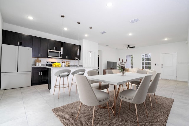 dining area with light tile patterned floors, visible vents, a ceiling fan, and recessed lighting