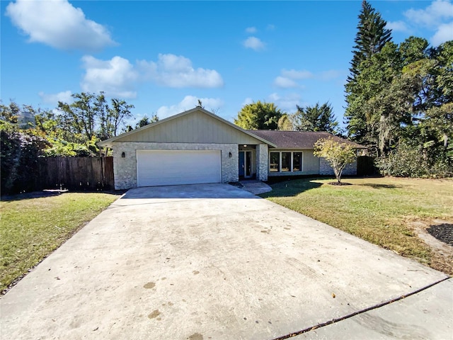 single story home with a garage and a front lawn