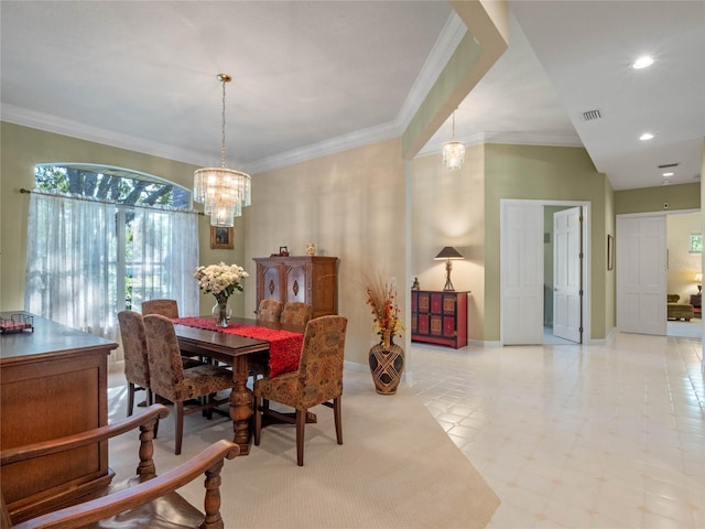 dining room with an inviting chandelier and ornamental molding