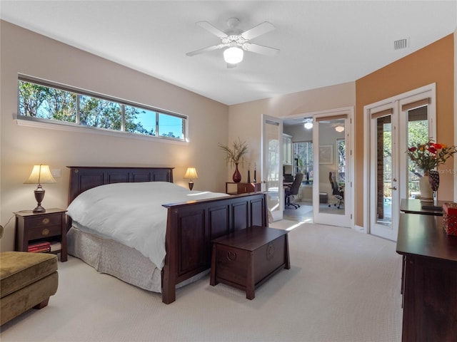 carpeted bedroom featuring french doors, access to outside, and ceiling fan