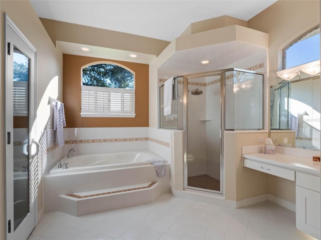 bathroom with vanity and independent shower and bath