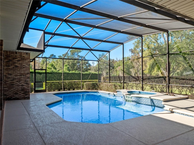 view of pool featuring a lanai, an in ground hot tub, and a patio