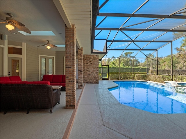 view of swimming pool with an outdoor living space, french doors, ceiling fan, a lanai, and a patio area