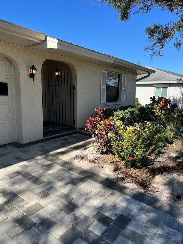 property entrance with a garage