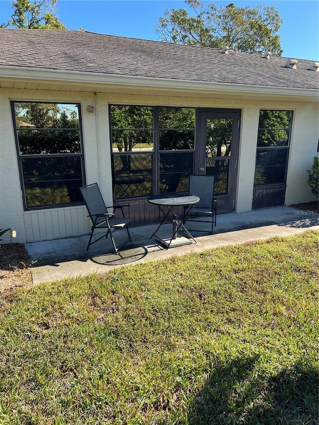 exterior space with a lawn and a patio area