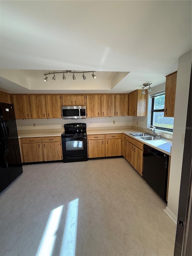 kitchen featuring sink and black appliances