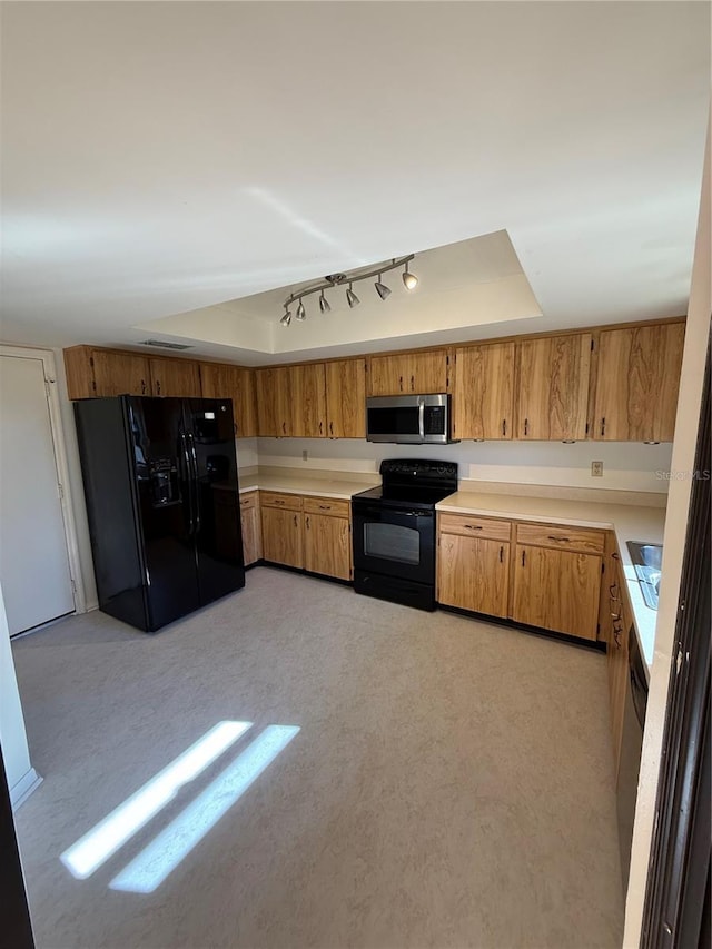 kitchen featuring sink and black appliances