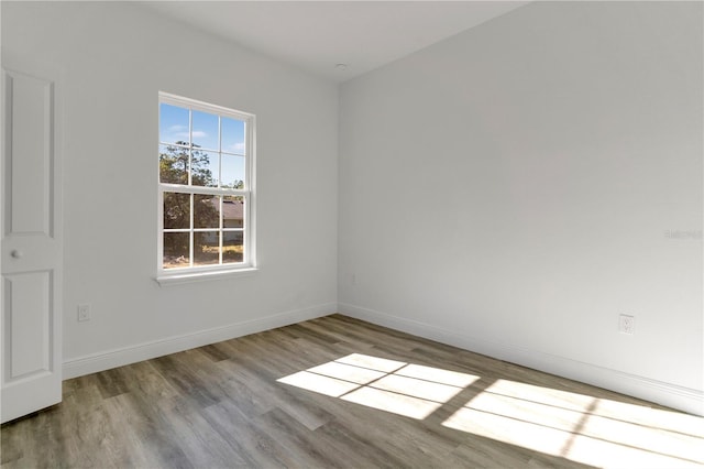 spare room featuring light wood-type flooring