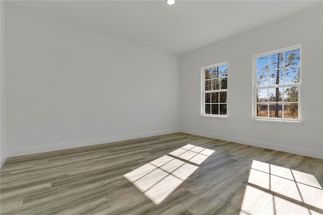 empty room with dark hardwood / wood-style flooring