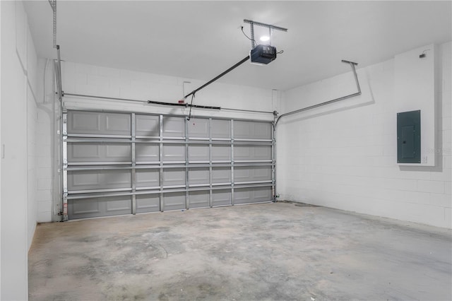 garage featuring electric panel and a garage door opener