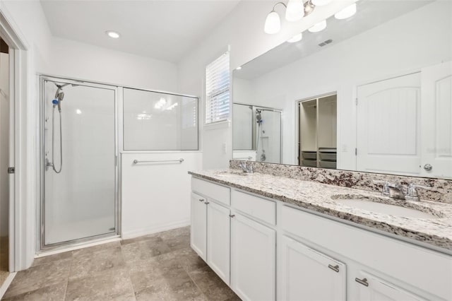 bathroom with vanity and an enclosed shower