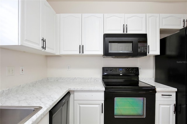 kitchen with white cabinetry, sink, and black appliances