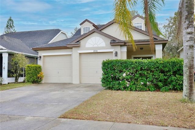 view of front of property with a garage