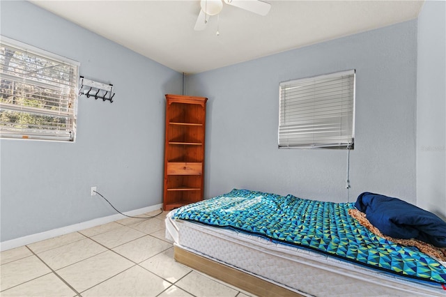 bedroom with light tile patterned floors and ceiling fan