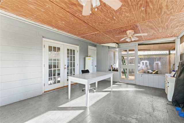 interior space featuring french doors, ceiling fan, and water heater