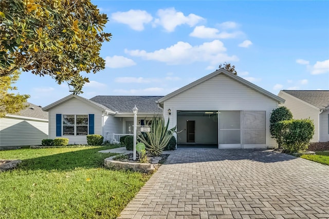 ranch-style house with a carport and a front lawn