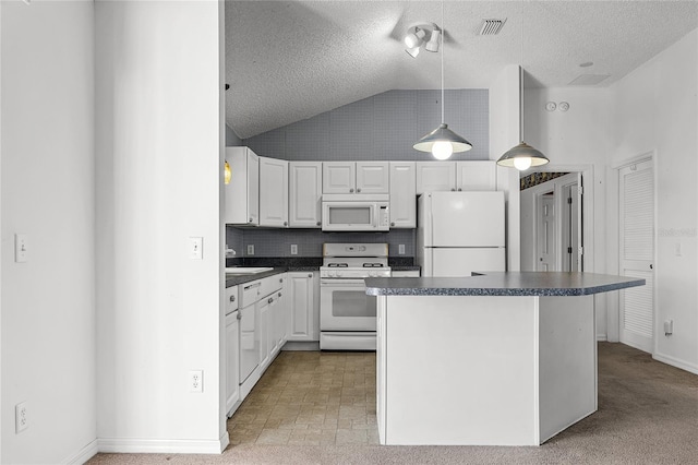 kitchen featuring white cabinets, white appliances, hanging light fixtures, and a textured ceiling