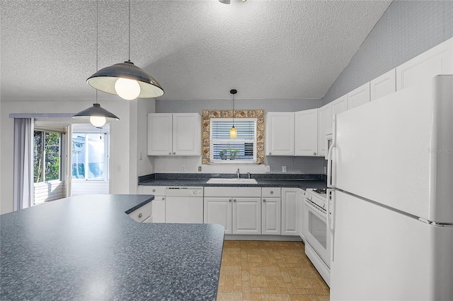 kitchen with white cabinetry, sink, lofted ceiling, decorative light fixtures, and white appliances