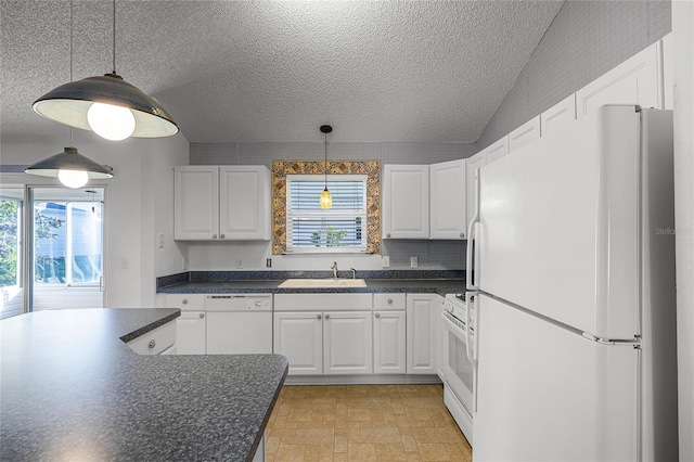 kitchen with white appliances, a textured ceiling, sink, pendant lighting, and white cabinets