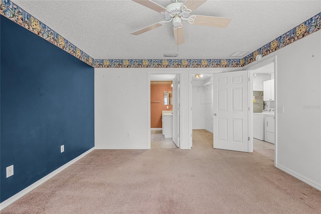 unfurnished bedroom featuring ceiling fan, a spacious closet, a textured ceiling, and a closet