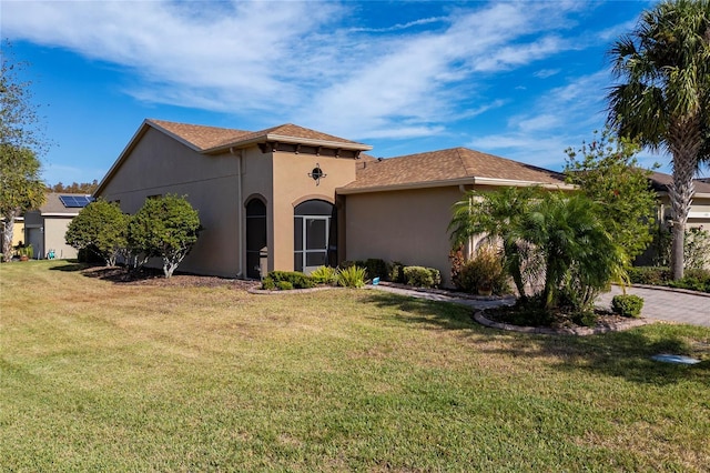 mediterranean / spanish-style house featuring a front yard