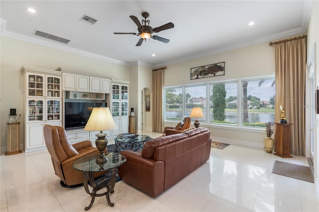 tiled living room featuring ceiling fan and crown molding