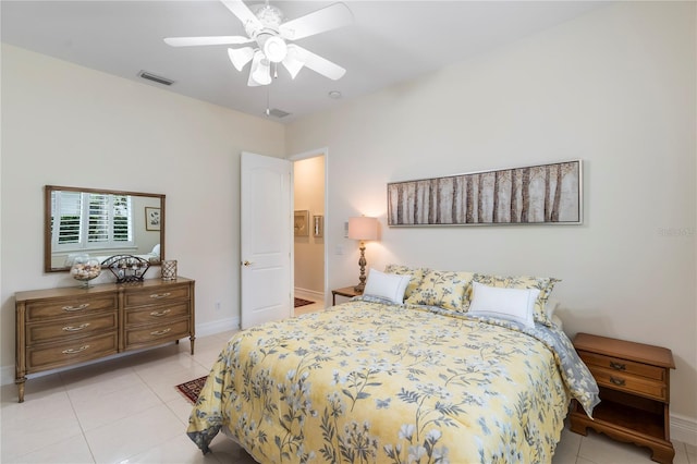 bedroom with ceiling fan and light tile patterned floors