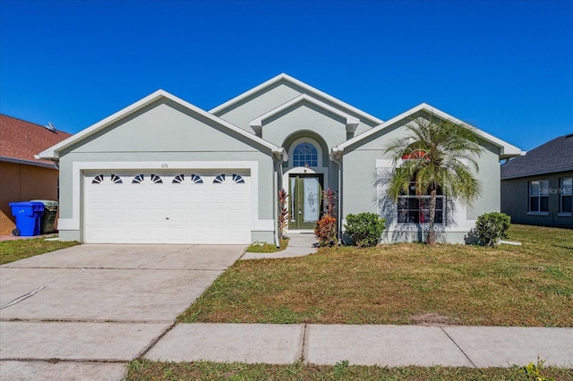 single story home with a front yard and a garage